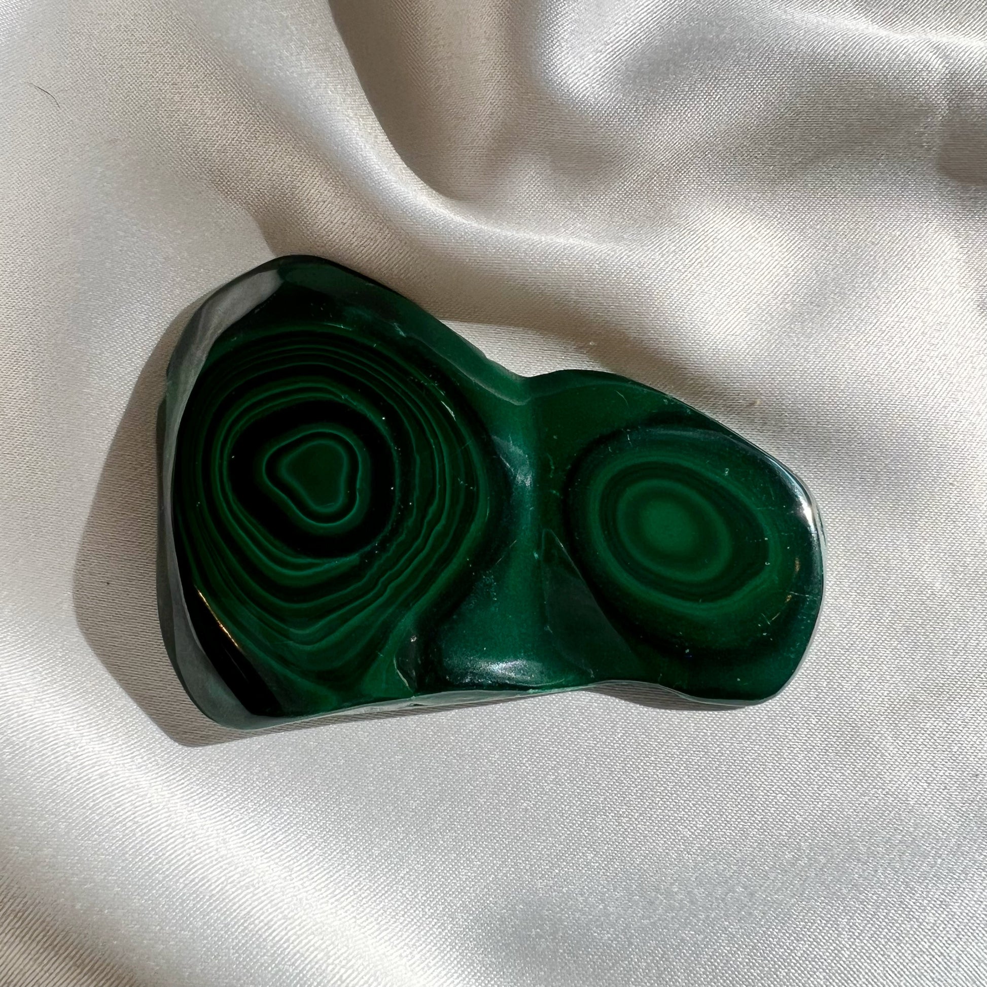 This listing is for one (1) Malachite Slab.  Known as the stone of transformation, Malachite helps bring energy and focus to new growth while pruning off the brambles holding you back. Malachite reminds us to turn over a new leaf. If you’re drawn to the vibrant Malachite crystal, it could mean that it’s time for a change.  Origin: Russia  Slab 1:  3.5in by 2.45in, .095kg