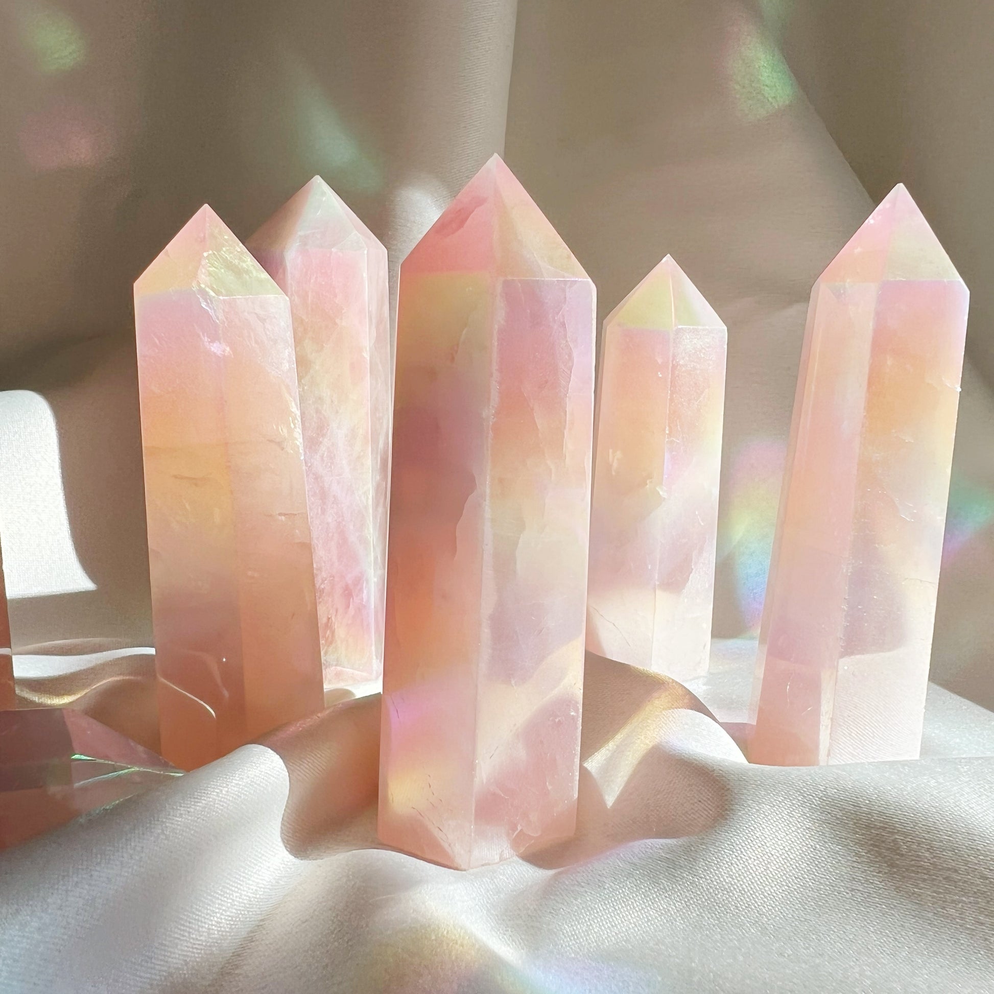 This listing is for one (1) Aura Rose Quartz Tower. Rose quartz draws off negative energy and replaces it with the good feels and love vibes. Rose Quartz can release your heartache, soothe the pain and ready your heart to receive love once again. Size: 3-3.5 inches tall